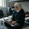 Anas_F._Al-khateeb_Libyan_student_age_20_in_dorm_room,_wearing_hijab_and_hoodie,_sit_5de54e5b-e1e3-4890-bf7c-31c89e26c01b